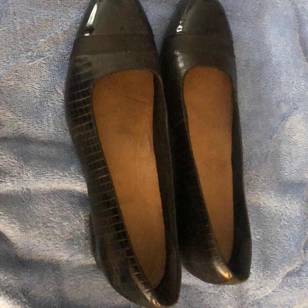 Women’s Clark’s black loafers.